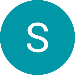 A person raising their glasses in a celebratory toast on a dhow cruise, featured in a testimonial photograph